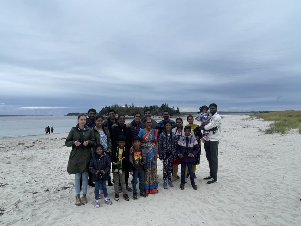 New Canadian families visiting Carter's Beach Provincial Park after a bird survey at the Port Joli Migratory Bird Sanctuary